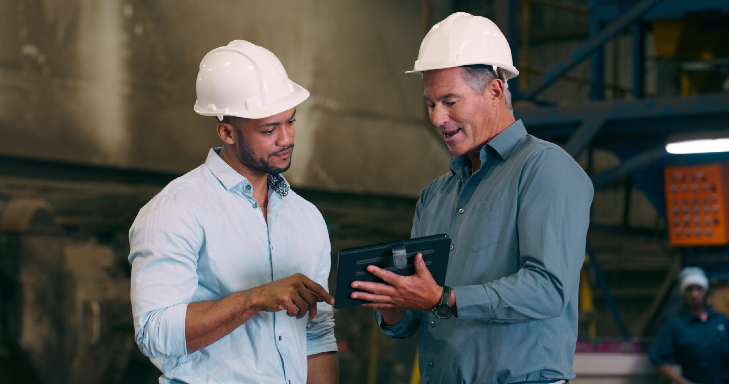 Project Managers discuss construction projects Silicon Valley Research & Development (R&D) Materials Engineering for prototype semiconductor tool move.
