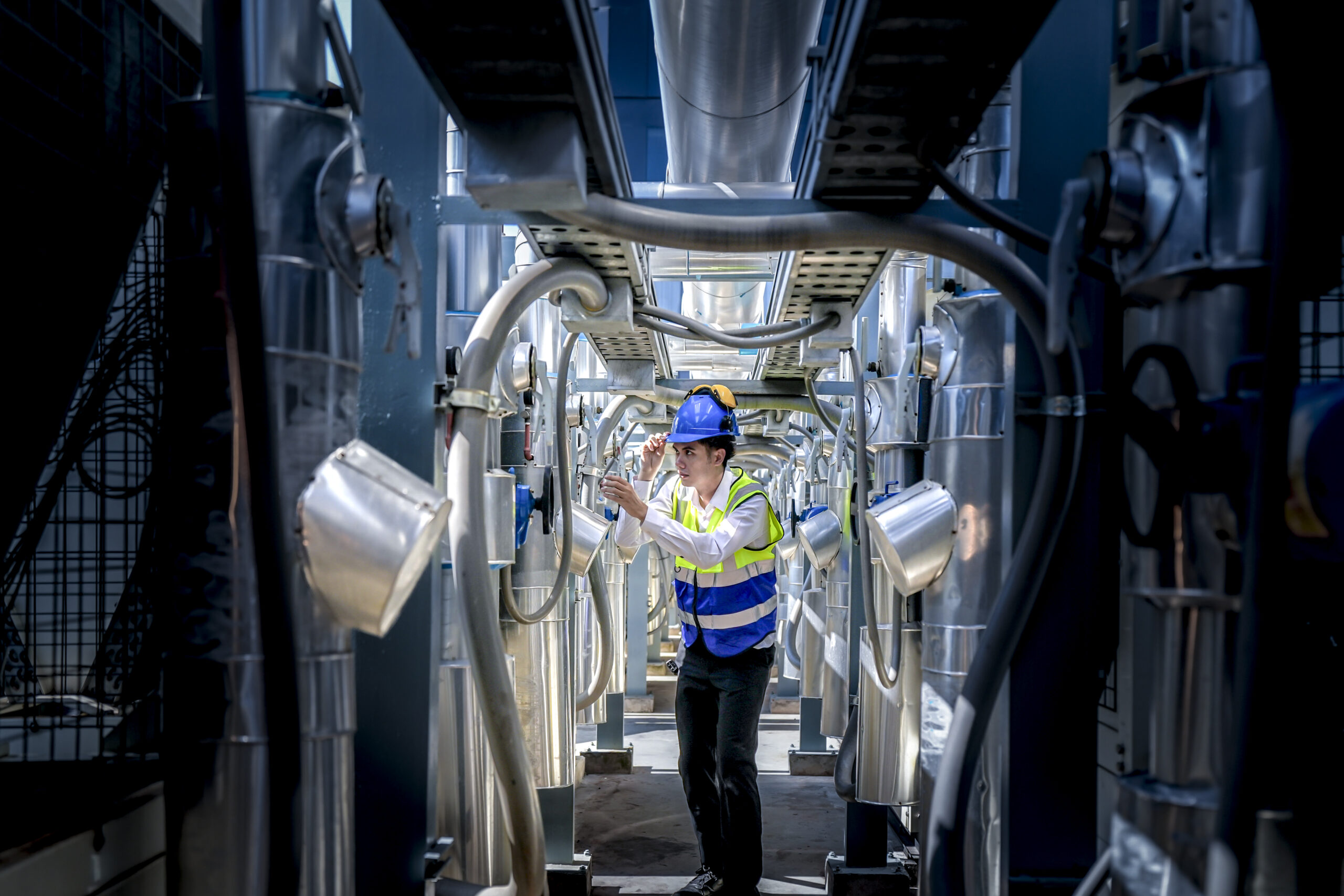 Silicon Valley technician in subfab inspects gas lines.