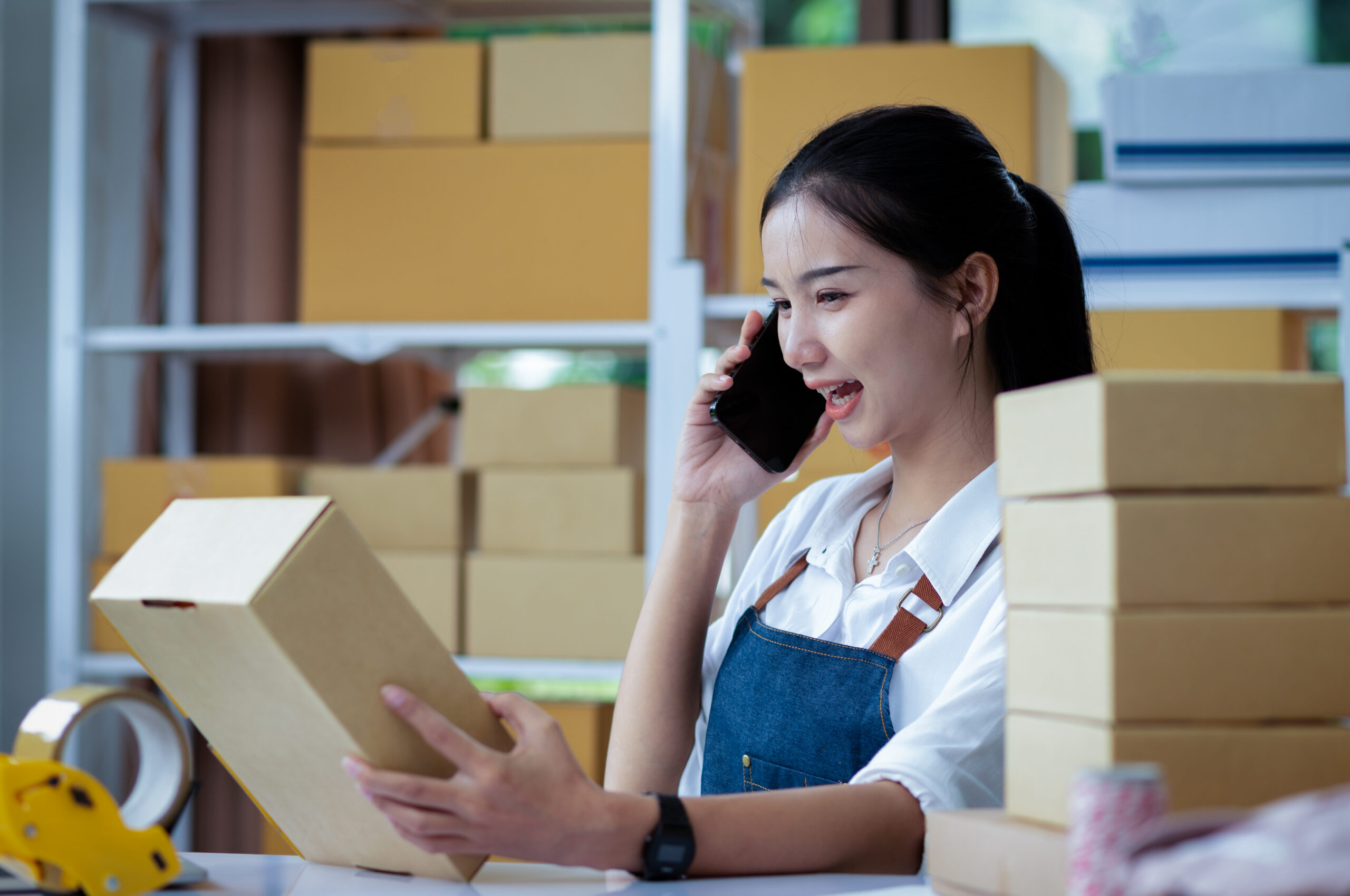 Silicon Valley woman receives shipments and notifies client in San Jose semiconductor research and development (R&D) facility.